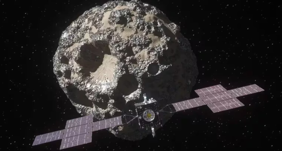 La nave espacial Psyche cerca del asteroide metálico Psyche.